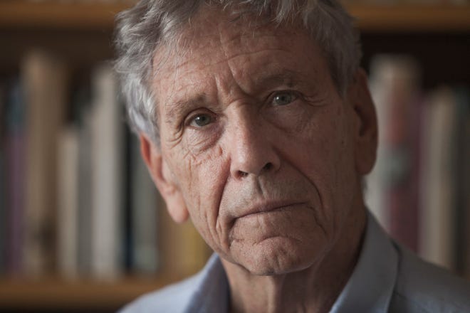 FILE - In this Nov. 4, 2015 file photo, Israeli writer Amos Oz poses for a photo at his house in Tel Aviv, Israel. Israeli media said Friday, Dec. 28, 2018 that renowned Israeli author Amos Oz has died at the age of 79. Oz, author of novels, prose and a widely acclaimed memoir, had suffered from cancer. Oz won numerous prizes, including the Israel Prize and Germany’s Goethe Award, and was a perennial contender for the Nobel Prize in literature. (AP Photo/Dan Balilty, File)