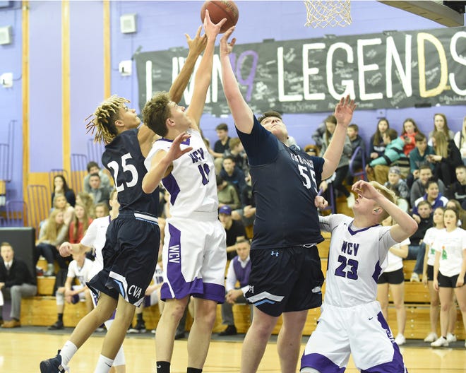 Players from West Canada Valley and Central Valley Academy compete for a rebound during Friday's championship game at the West Canada Sports Boosters' holiday basketball tournament.     

[Photo Courtesy of Bob Critser, digitalsportsphotography.net]