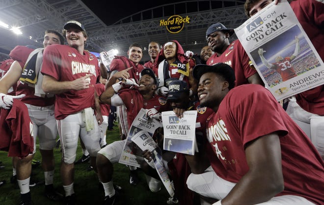 The Alabama team poses on the field at the end of the Orange Bowl NCAA college football game against Oklahoma, Saturday, Dec. 29, 2018, in Miami Gardens, Fla. Alabama defeated Oklahoma 45-34. (AP Photo/Lynne Sladky)