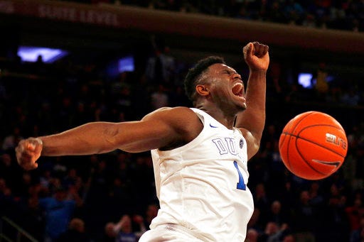 File- This Dec. 20, 2018, file photo shows Duke forward Zion Williamson (1) dunking the ball against Texas Tech during the first half of an NCAA college basketball game in New York. Williamson is one of the names you may not know now but very well could by the end of 2019. They figure to come up big in the new year.(AP Photo/Adam Hunger, File)