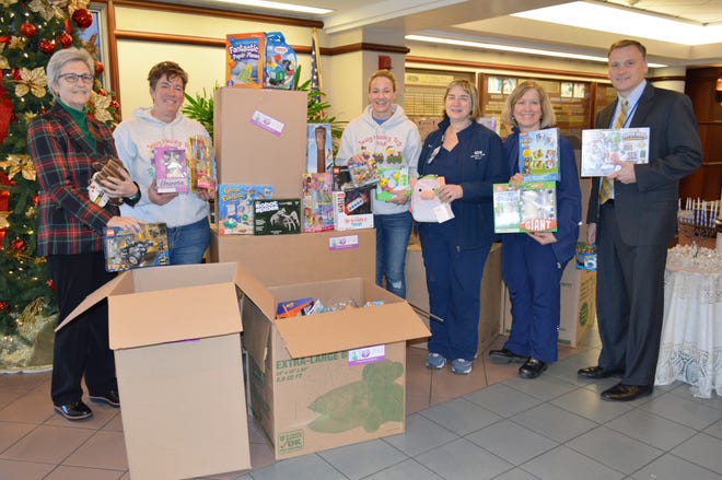 On Dec. 18, the nonprofit Sassy Massey stopped by Grand View Health to deliver hundreds of toys for Grand View’s pediatric patients to enjoy. The toy drive was started in 2016 by Jillian Massey, who died at age 5. She wished for all kids in the hospital to have toys over the holidays and her family has continued the mission, this year giving away thousands of toys to area hospitals. From left: Jean Keeler, president and CEO, Grand View Health; Joy Yoder, Sassy Massey; Janelle Massey, Sassy Massey; Kathleen Peca, director of Maternal Child Health; Kathleen Shafer, clinical coordinator pediatrics and well nursery; Doug Hughes, senior vice president, chief strategy officer. [COURTESY GRAND VIEW HEALTH]
