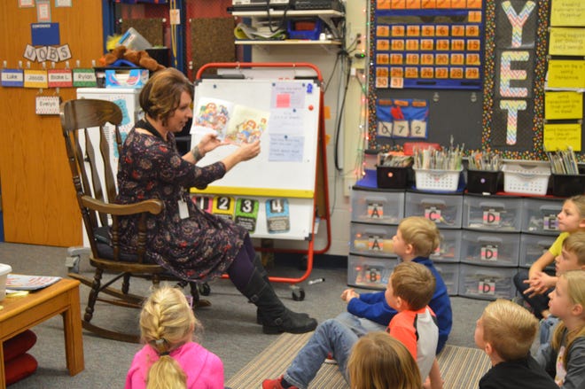 Kristi Zoerhof reads a book to her first-graders at Bentheim Elementary Zoerhof has taught for 16 years, and 15 of those years have been at Benthiem. [Erin Dietzer/Sentinel staff]