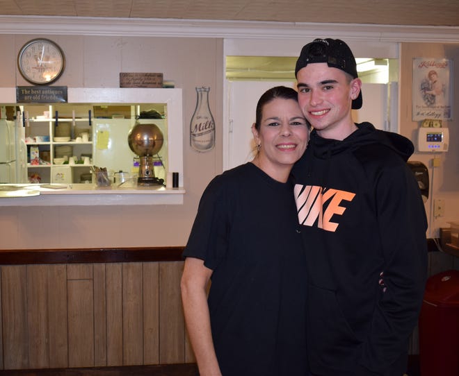 Tammy Lieberman stands with her son Tyler at The Busy Bee Cafe, located on 7th Street in DeFuniak Springs. [NATHAN COBB/THE SUN]