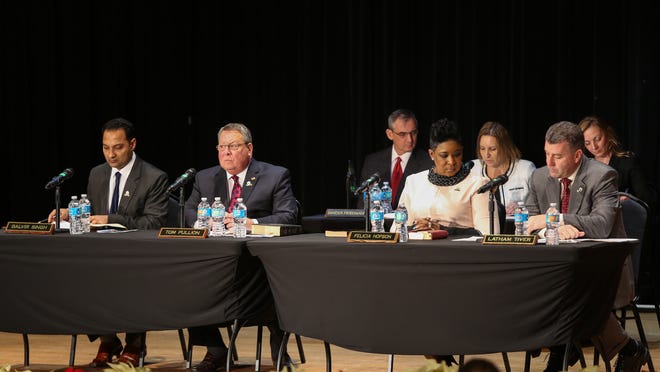 From left, Burlington County Freeholders Balvir Singh, Tom Pullion, Felicia Hopson and Latham Tiver sit during the annual reorganization meeting at Rowan College at Burlington County on Tuesday. [DAVE HERNANDEZ / PHOTOJOURNALIST]
