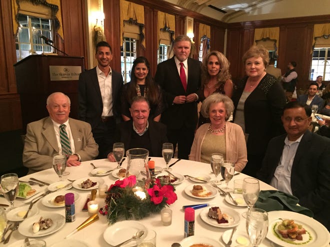 ABOVE: Seated: Michael Carrier, Councilman Larry McAtee, Jo Ann McAtee, and Champ Patel. Standing: Harshil Patel, Trushna Patel, Robert Lewter, Delanna Lewter and Sharon Buchanan. [PHOTO PROVIDED]