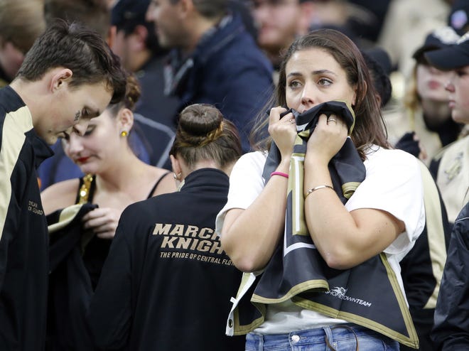 UCF fans react after the Fiesta Bowl between LSU and UCF on Tuesday in Glendale, Ariz. [RICK SCUTERI/THE ASSOCIATED PRESS]
