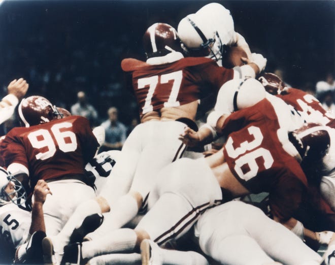Alabama linebacker Barry Krauss (77) stops Penn State's Mike Guman short of the end zone on fourth down in the 1979 Sugar Bowl. Alabama defeated the Nittany Lions 14-7 to win the national championship. [Photo/Bryant Museum]