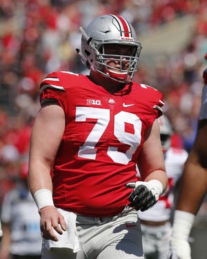 Ohio State football player Brady Taylor Taylor played as a backup in the opener against Oregon State before having arthroscopic knee surgery. He didn’t play again until offensive line coach Greg Studrawa had him make the final snap on Tuesday at right guard. (Barbara J. Perenic)