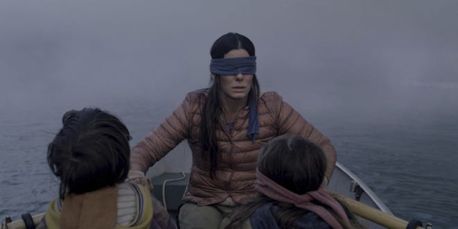 FILE- This file image released by Netflix shows Sandra Bullock in a scene from the film, "Bird Box." Netflix lifted the usually tightly sealed lid on its viewership numbers in a recent tweet that disclosed 45 million subscriber accounts had watched the thriller, þÄúBird Box,þÄù during its first seven days on the service. That made the film the biggest first-week success of any movie made so far for NetflixþÄôs 12-year-old streaming service. (Merrick Morton/Netflix via AP, File)