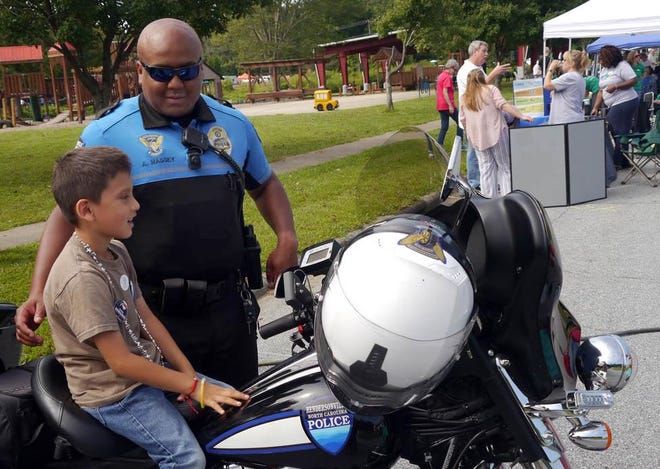 Officer Andy Massey is shown at the Back to School fest in August at Sullivan Park.