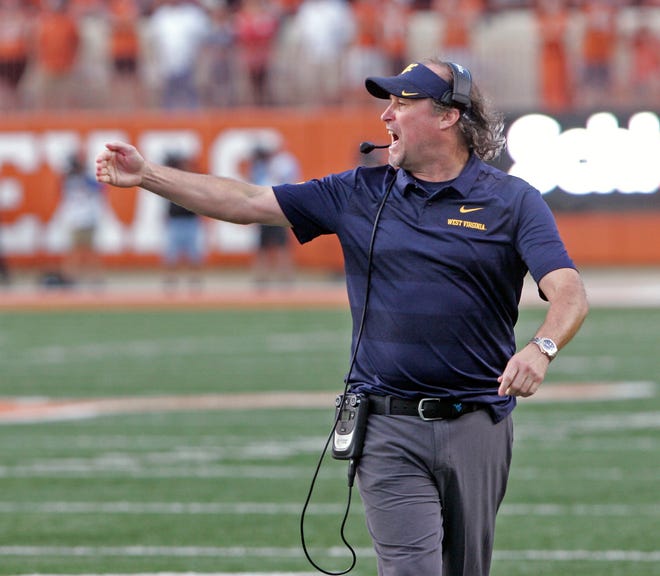 Dana Holgorsen was 61-41 in eight years at West Virginia. [AP FILE PHOTO]