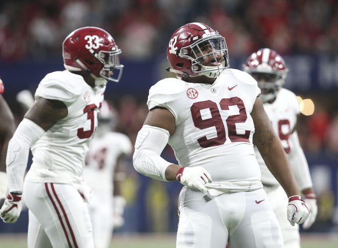 Alabama defensive lineman Quinnen Williams (92) celebrates after sacking Georgia quarterback Jake Fromm during the first half of the SEC Championship Game on Dec. 1, in Atlanta. Williams will start for Alabama in Monday's national title game against Clemson. [Staff Photo/Gary Cosby Jr.]