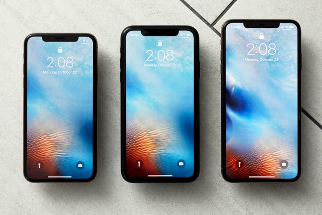 FILE - This Oct. 22, 2018, file photo shows the iPhone XS, from left, iPhone XR, and the iPhone XS Max in New York. Apple warns that disappointing iPhone sales will cause a significant drop in its revenue over the crucial holiday season compared to earlier projections. CEO Tim Cook made the announcement after the market closed Wednesday, Jan 2, 2019. (AP Photo/Richard Drew, File)