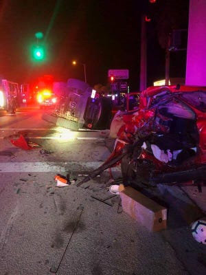 A Jeep lays on its side after running into a parked car Wednesday night on Anastasia Boulevard. [St. Augustine Police Department]