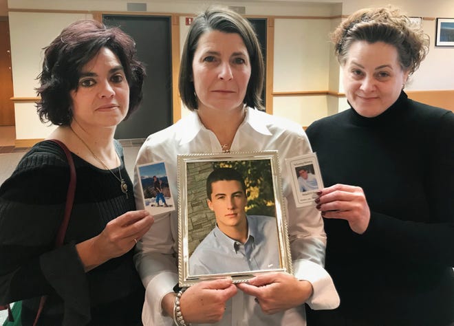From left, Debra Vars, Hope McDonald and Jennifer Davis hold up photos of their sons, Hunter Vars, Jack Perreault and Malachi Davis, who were killed in a 2016 drunken-driving crash after drinking at Jade Palace in Stratham. The restaurant was fined $100,000 Friday for serving Perreault alcohol under the age of 21. [Alexander LaCasse/Seacoastonline]