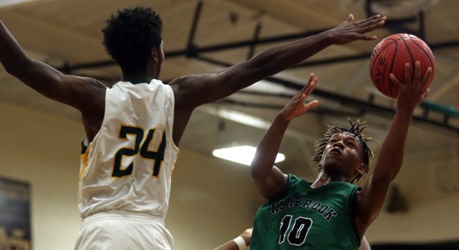 Ashbrook's Chris Britt looks to score past Crest's Jadin Merritt during their game at Crest High School on Friday. [Brittany Randolph/The Star]