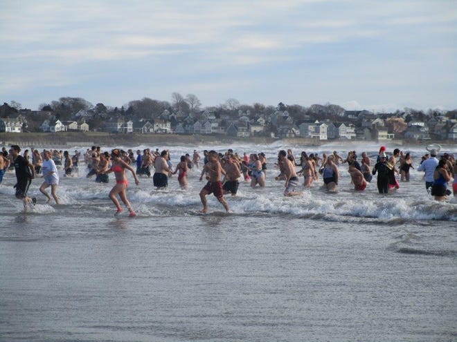 It was a great day at Easton's Beach in Newport for the Polar Plunge. Over 2,000 spectators lied the shore, with over 300 bracing the cool waters on this traditional event. [Submitted Photo]