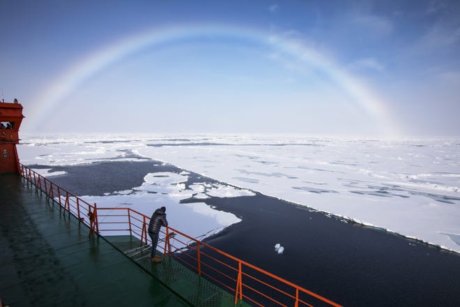 A white rainbow across the arctic sky as seen from the Russian icebreaker 50 Let Pobedy (or, in English, 50 Years of Victory), which carries passengers to the North Pole. Countries will likely fight for northern territory in 2019 as icecaps continue to melt. [File/Mark Chilvers/The Washington Post]