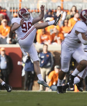 Alabama;s Mike Bernier punts in his first opportunity to start during the first half against Tennessee in Neyland Stadium, Saturday, Oct. 20, 2018. [Staff Photo/Gary Cosby Jr.]