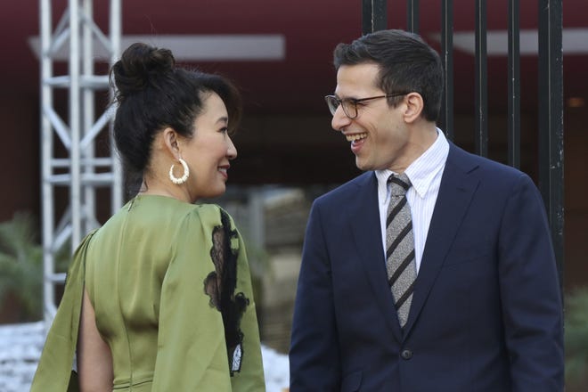 Sandra Oh, left, and Andy Samberg smile at each other after rolling out the red carpet at the 76th annual Golden Globe Awards Preview Day at The Beverly Hilton on Thursday in Beverly Hills, Calif. [Photo by Willy Sanjuan/Invision/AP]
