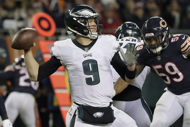 Philadelphia Eagles quarterback Nick Foles (9) passes during the first half of an NFL wild-card playoff football game against the Chicago Bears Sunday. [Nam Y. Huh/AP Photo]