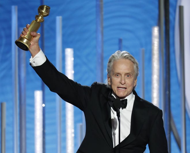 This image released by NBC shows Michael Douglas, winner of best actor in a TV series, musical or comedy for his role in "The Kominsky Method" at the 76th Annual Golden Globe Awards at the Beverly Hilton Hotel, Sunday, Jan. 6, 2019 in Beverly Hills, Calif. (Paul Drinkwater/NBC via AP)