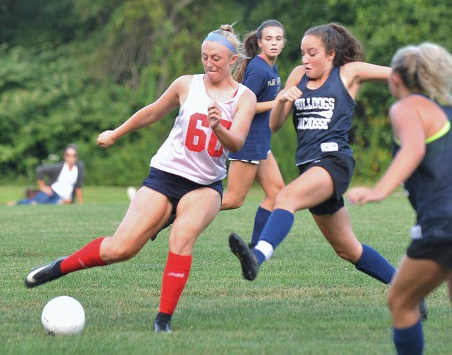 Archbishop Williams' MacKenzie Heath, left, controls the ball as Rockland's Madison Blonde moves in during a scrimmage, Monday, Aug. 27, 2018. Tom Gorman/For The Patrot Ledger