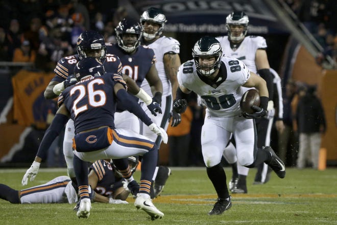 Philadelphia Eagles tight end Dallas Goedert (88) runs after catching a pass during an NFC wild card game against the Chicago Bears on Sunday in Chicago. [Photo by AP]