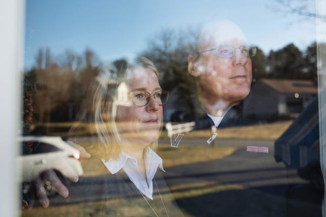 Michael and Carole Maguire in their home near the school their daughter with special needs attends, in Osterville, Mass. [Kieran Kesner / The New York Times]