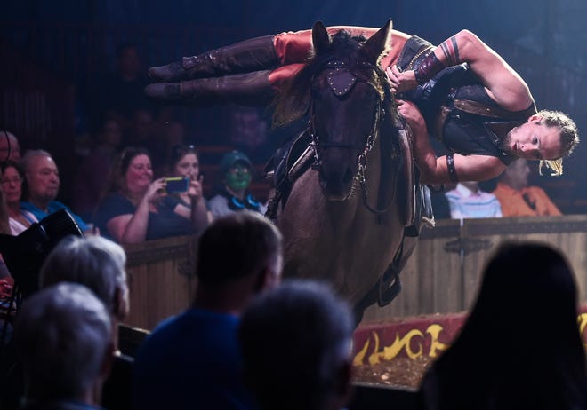 Ermes Zamperla performing during opening weekend of Cirque MaíCeo Saturday afternoon, January 5, 2019, at Big Cat Habitat & Gulf Coast Sanctuary in Sarasota. Sarasota native Olissio Zoppe, off camera, is leading his national-touring Cirque MaíCeo equestrian show in his hometown for the first time with part of the proceeds going to help raise funds for his lifelong friend Clayton Rosaire's nonprofit Big Cat Habitat & Gulf Coast Sanctuary. The show features the Zoppes' signature bareback riding, Cossack-style trick riding and dressage; with acrobats, aeralists and jugglers performing atop and alongside the moving horses. There's also a clown act for the youngsters. Showtimes are 6 p.m. Fridays; 3:30 and 6 p.m. Saturdays and 3:30 p.m. Sundays through Feb. 3 in the big white tent in front of Big Cat Habitat & Gulf Coast Sanctuary, 7101 Palmer Blvd., Sarasota; $10-$45; 561-758-7851 or cirquemaceo.com. Parking is free and VIP show and dinner tickets are available. [Herald-Tribune staff photo / Thomas Bender]
