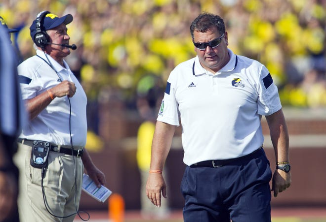 Greg Mattison, left, was Michigan's defensive coordinator under coach Brady Hoke in 2014. [AP file photo]
