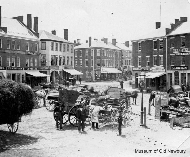 If this 1882 photograph of activity in Market Square looks slightly askew to Portsmouth viewers, that's because it is Market Square in Newburyport, Massachusetts. Founded as Newbury in 1635, this sister shipbuilding port on the Merrimack River has a near parallel 400-year history to Portsmouth that includes a devastating downtown fire in 1811 after which the city center was rebuilt in brick. [Photo copyright Museum of Old Newbury, used by permission]