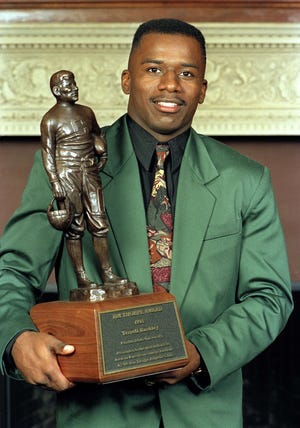 Former FSU All-American Terrell Buckley poses with his Jim Thorpe award in King's Mill, Ohio, Dec. 7, 1991. Monday, Buckley was inducted into the College Football Hall of Fame. [DAVID KOHL/THE ASSOCIATED PRESS/FILE]