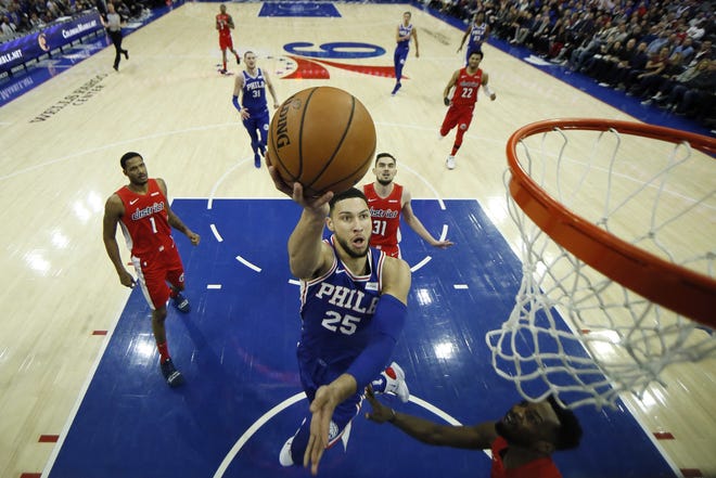 The Philadelphia 76ers' Ben Simmons goes up for a shot during the first half Tuesday against the Washington Wizards in Philadelphia. [Matt Slocum/Associated Press]