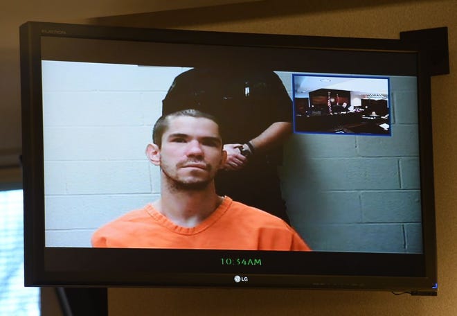 Erik Cunningham, charged with murder in the fatal shooting of his wife, Lacie, in their northeast Ohio home, appeared via video for arraignment last week in a Portage County courtroom in Ravenna. [Lisa Scalfaro/Kent Record-Courier]