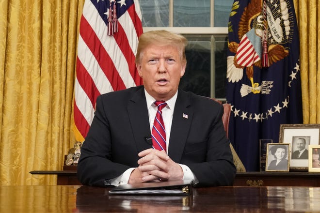 President Donald Trump speaks from the Oval Office of the White House as he gives a prime-time address about border security Tuesday, in Washington. [Carlos Barria/AP Photo]
