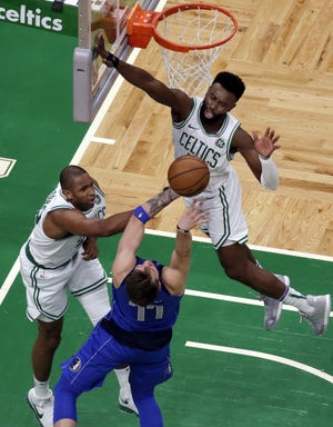 Celtics center Al Horford (left) and guard Jaylen Brown will be key factors in the Boston's consistency throughout the rest of the season. [AP File Photo/Elise Amendola]
