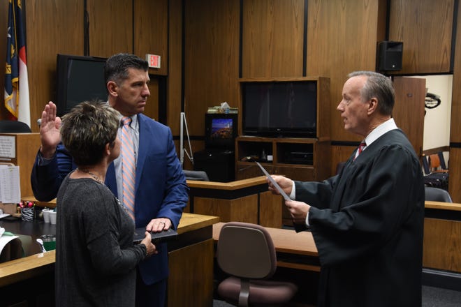 Michael Miller is sworn in for his second term as Cleveland County District Attorney by Superior Court Judge Don Bridges. [Special to The Star]