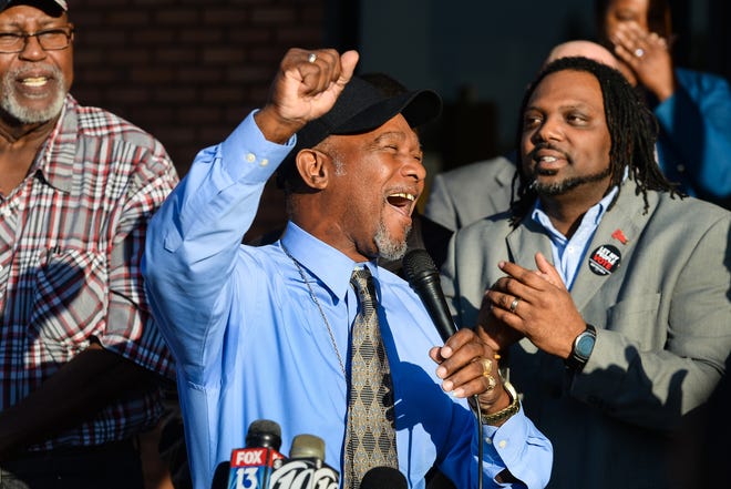 Pastor Wesley Tunstall praises God while addressing media at the Sarasota County Supervisor of Elections Office on Tuesday. Tunstall, a convicted felon, registered to vote on Tuesday, the first day that Amendment 4 went into effect. [HERALD-TRIBUNE STAFF PHOTO / DAN WAGNER]