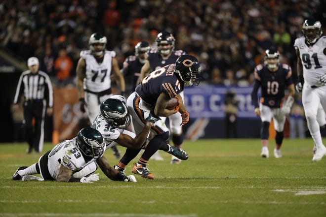 Chicago Bears wide receiver Taylor Gabriel is tackled by Philadelphia Eagles outside linebacker Nigel Bradham, left, and cornerback Rasul Douglas on Sunday. [Nam Y. Huh / The Associated Press]