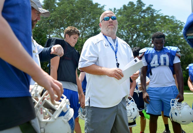 Athletic Director Jim Nichols instructs his team during football practice at Mount Dora Christian Academy on May 18, 2016 in Mount Dora. Nichols stepped down as the Bulldogs' AD to take a position at Liberty University. [DAILY COMMERCIAL FILE]