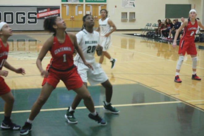 FPC's Quetrina Brown (20) battles a Centennial player for a rebound. The Lady Bulldogs won the game 50-43. [News-Tribune/Andy Mikula]