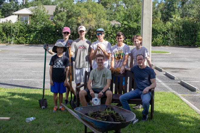 For his Eagle Scout Project, Joe Johnson created a stone pathway to a small seating area at Redeemer Church on Roscoe Boulevard. Here, Johnson is pictured with his work crew and Sean Yost, pastor of Redeemer Church. [CONTRIBUTED]