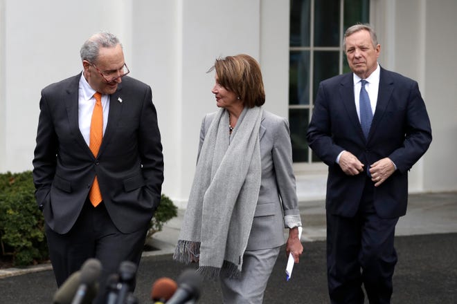 Senate Minority Leader Chuck Schumer of N.Y., House Speaker Nancy Pelosi of Calif., and Sen. Dick Durbin, D-Ill., arrive to speak with reporters after a meeting with President Donald Trump in the Situation Room of the White House on Wednesday in Washington about border security. [Evan Vucci/The Associated Press]