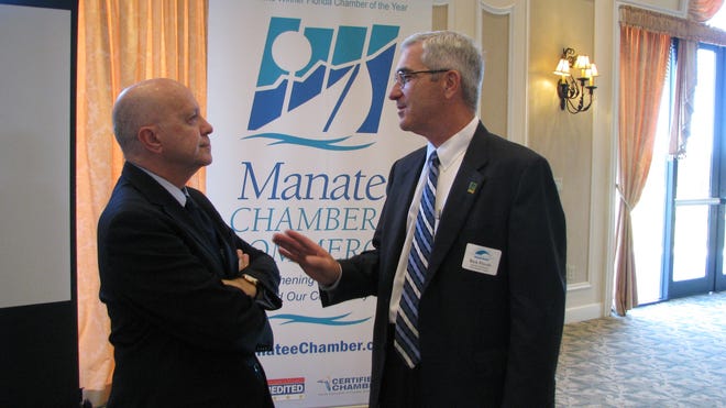 Port Manatee Executive Director Carlos Buqueras and Sarasota-Bradenton International Airport Chief Executive Rick Piccolo confer before making presentations before the Manatee Chamber of Commerce in January 2017. On Jan. 9, 2018, they gave updates to the Chamber and described business at both transportation hubs in 2018 as "tremendous." [HERALD-TRIBUNE STAFF PHOTO / DALE WHITE]