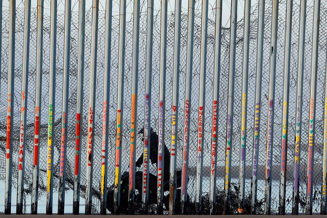 A U.S. Border Patrol agent rides a vehicle on the beach in San Diego, Wednesday, Jan. 9, 2019, seen through the border wall from Tijuana, Mexico. U.S. President Donald Trump walked out of his negotiating meeting with congressional leaders Wednesday — "I said bye-bye," he tweeted— as efforts to end the 19-day partial government shutdown fell into deeper disarray over his demand for billions of dollars to build a wall on the U.S.-Mexico border. (AP Photo/Gregory Bull)