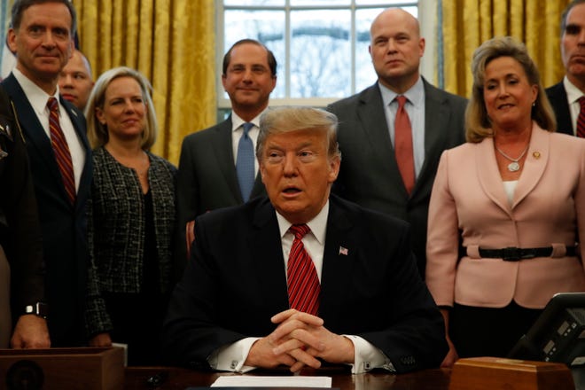 President Donald Trump talks to the media before signing anti-human trafficking legislation, Wednesday Jan. 9, 2019, in the Oval Office of the White House in Washington. (AP Photo/Jacquelyn Martin)