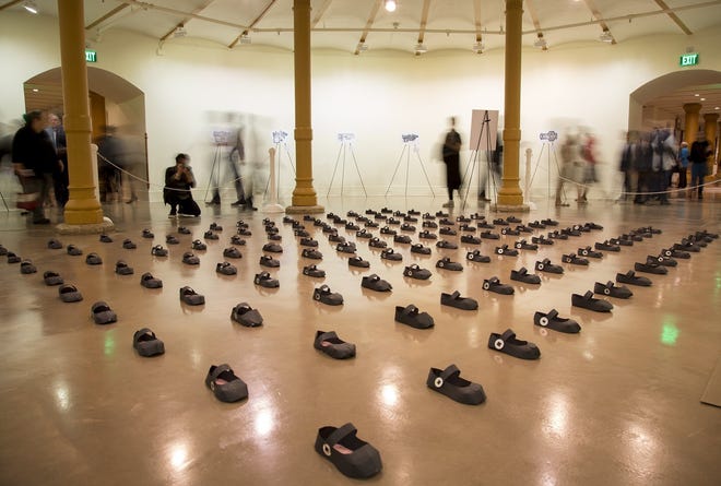 More than 100 paper shoes are displayed on the ground floor of the Capitol this week. "Assemble to Disassemble" is a three-piece art exhibit that seeks to bring attention to gun violance. The paper shoes were handmade by friends of the artist Lalena Fisher. [ANA RAMIREZ/AMERICAN-STATESMAN]