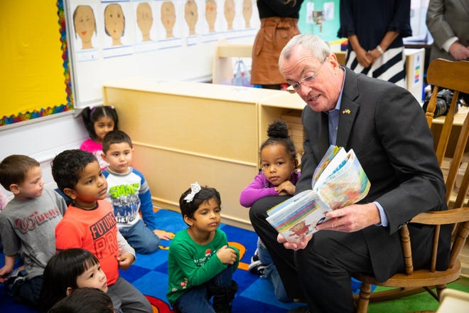 Gov. Phil Murphy reads to students at the Woodmere Elementary School in Eeatontown, Monmouth County, on Thursday before announcing $26.9 million in preschool expansion funding for 33 school districts, including Maple Shade and North Hanover. [COURTESY OF NJ GOVERNOR'S OFFICE]