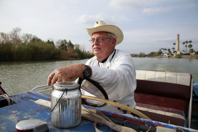 Father Roy Snipes, pastor of the La Lomita Chapel, shows Associated Press journalists the land on either side of the Rio Grande at the US-Mexico border in Mission, Texas. Portions of Father Snipes' church land in Mission could be seized by the federal government to construct additional border wall and fence lines. Rather than surrender their land to the federal government, some property owners on the Texas border are digging in to fight President Donald Trump's border wall. They are rejecting buyout offers and preparing to battle the administration in court. Trump is scheduled to travel to the border Thursday to make the case for his $5.7 billion wall. [John L. Mone/AP Photo]
